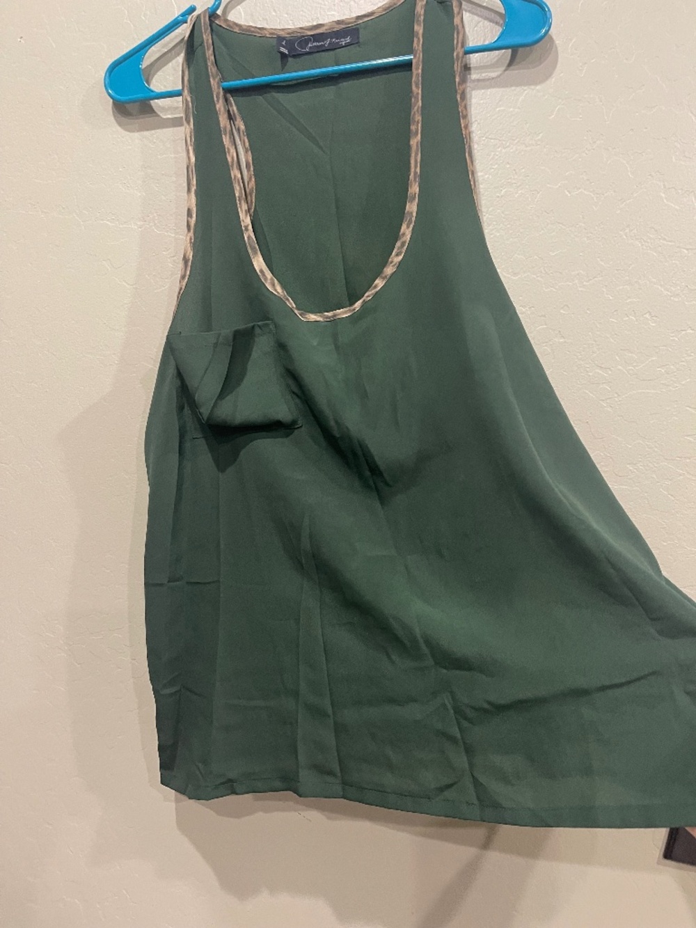 Flowy green racer back top animal print accent